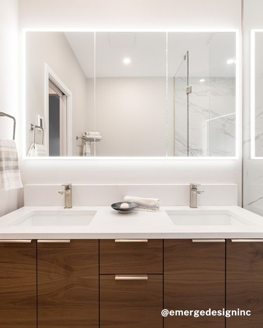 a classic luxurious bathroom featuring a wooden vanity and LED medicine cabinet