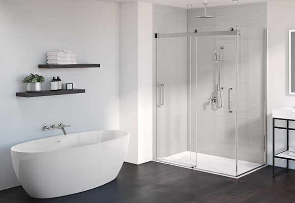 A modern relaxing white bathroom featuring a frameless glass shower enclosure, a freestanding bathtub, a freestanding vanity and a rectangular LED mirror