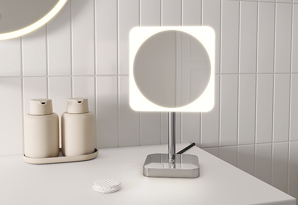 a cosmetic led mirror with Chrome finish standing on the counter.